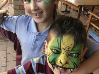 Face painting and balloon twisting for kids party