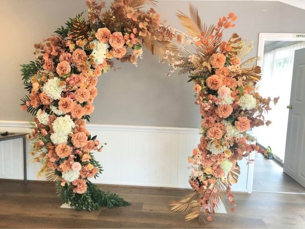 gold-orange-floral-arbour-floral-backdrop-wedding-ceremony-big-0