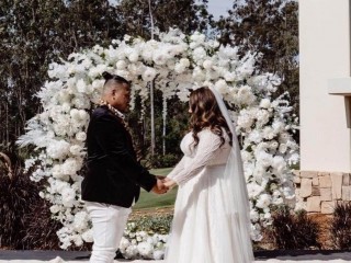 White floral round arbour , wedding arch . White backdrop.