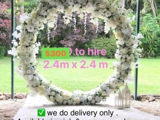 White floral circle shape . White backdrop . Wedding arbour .