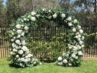 Greenery white floral arbour , floral event backdrop. Ceremony arbour .