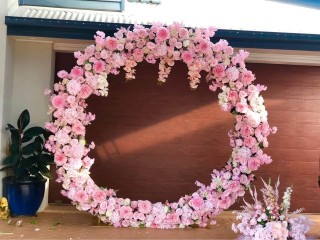 Artificial pink mix white wedding arbour , pink floral arbour in round shape for hire . Backdrop.