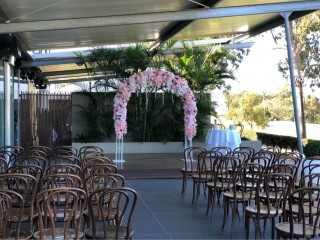 Wedding, event floral arbour in red , white , pink and blue theme .