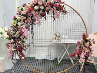 Hire - Gold backdrop with pink flower arrangement